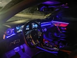LED ambient lighting illuminating the interior of a modern vehicle at night.