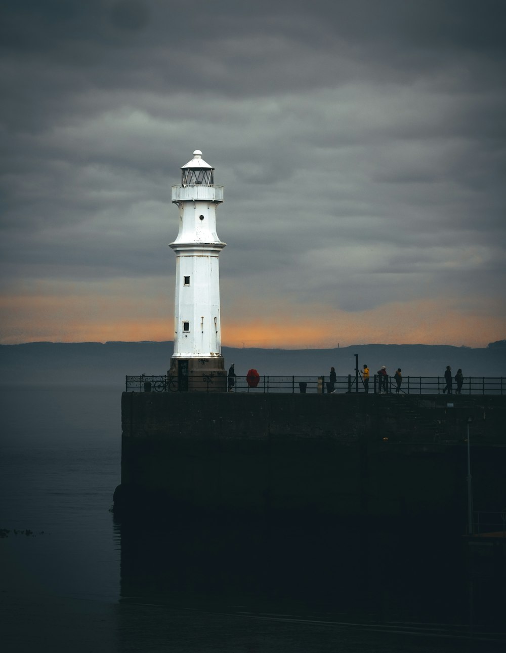 a lighthouse on a pier