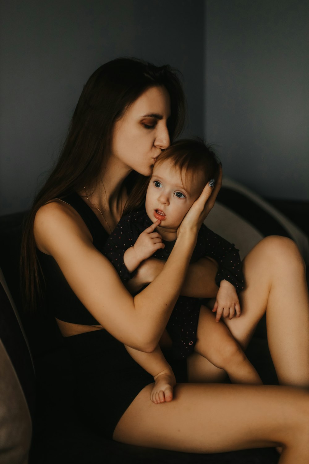 a woman holding a baby