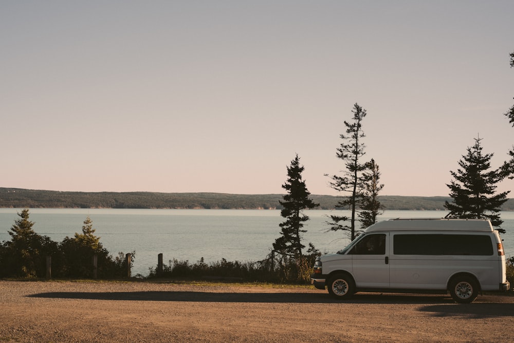 a van parked by a lake