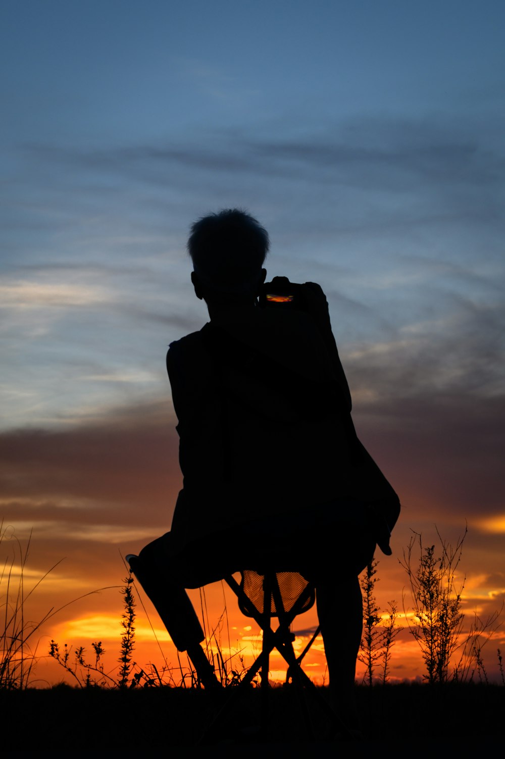 a silhouette of a person with a gun