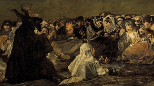 A group of people are gathered, with a figure resembling a goat-headed creature sitting prominently. The individuals are clothed in dark, worn garments, and many have expressions of intrigue or fear. The scene is dimly lit with an ominous, shadowy atmosphere.