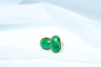 a pair of green and black dice