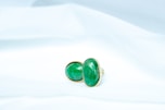 a pair of green and black dice