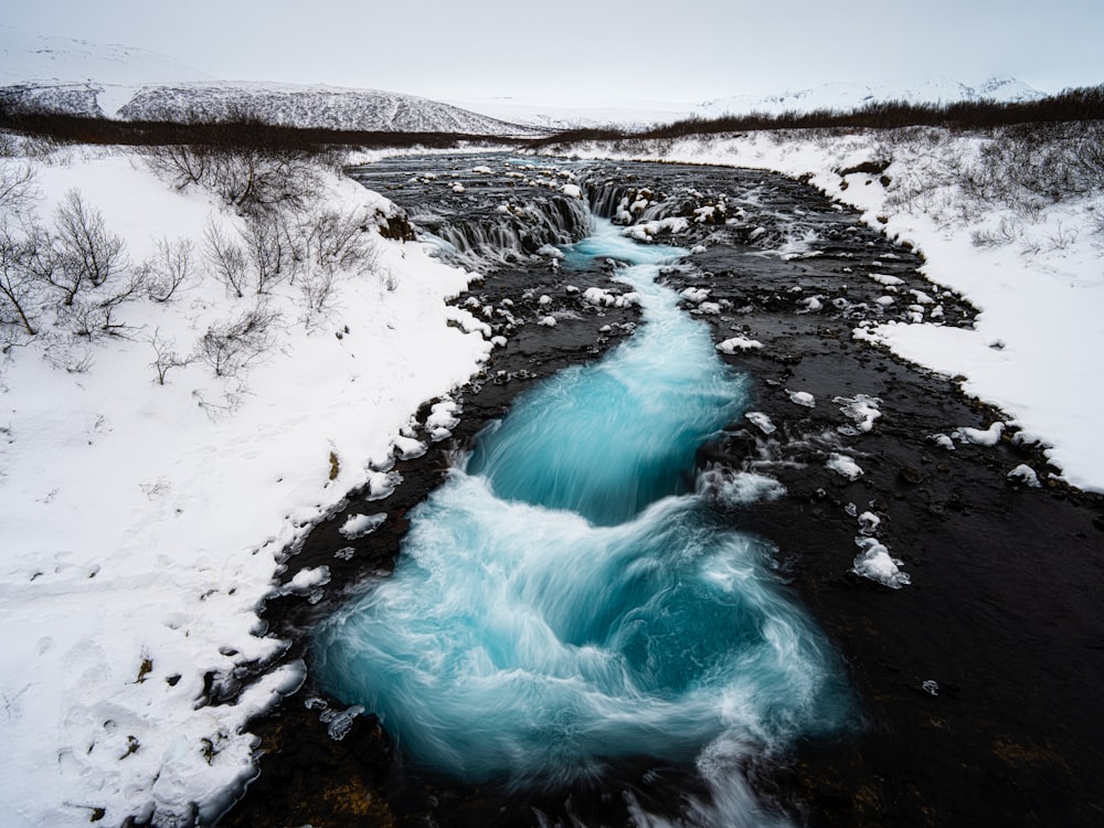 a river with ice and snow