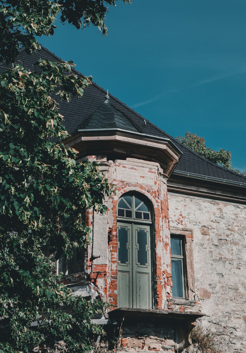 a stone building with a door and windows