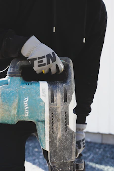 a person holding a skateboard