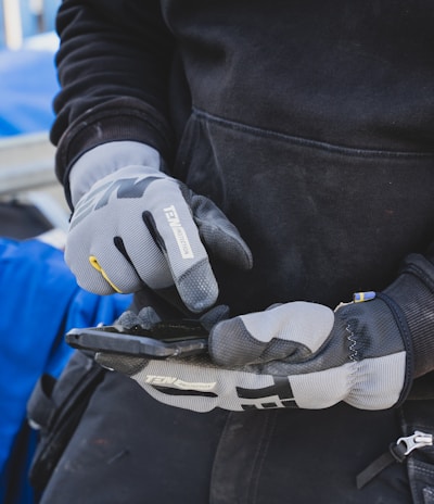 a gloved hand holding a glove