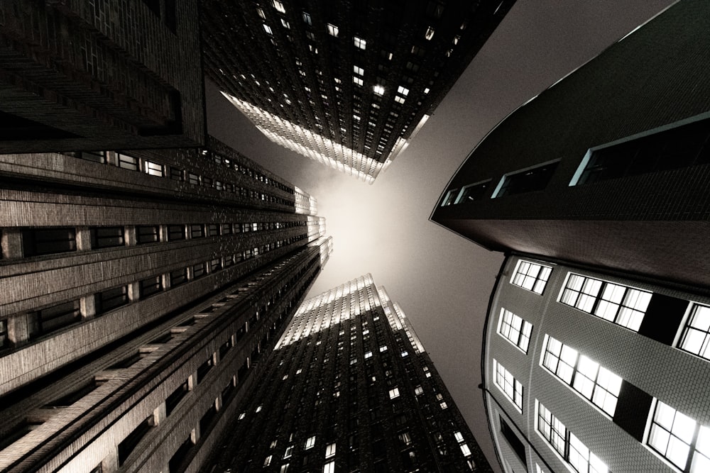 a view looking up at tall buildings