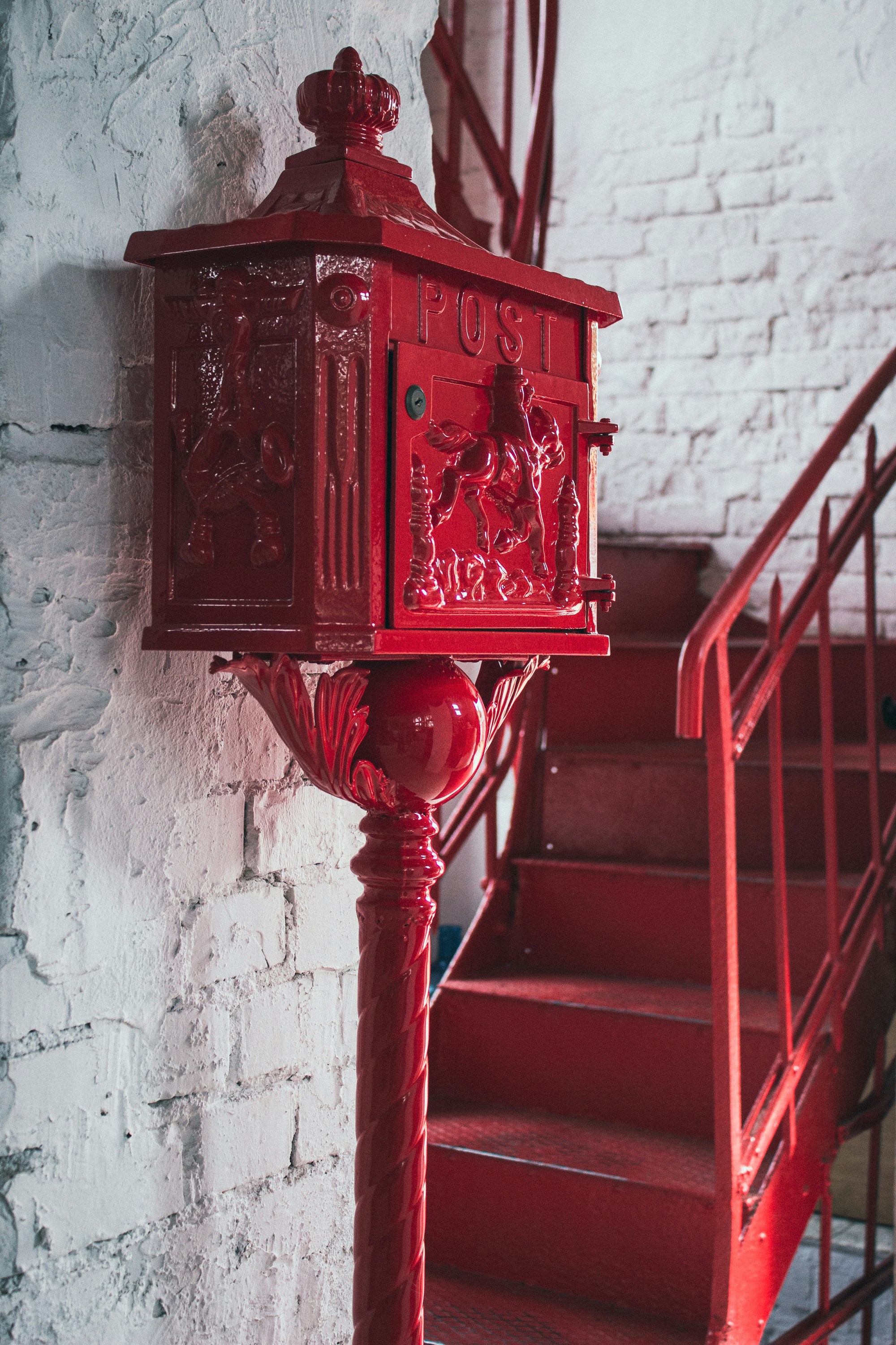 a red and black box on a staircase