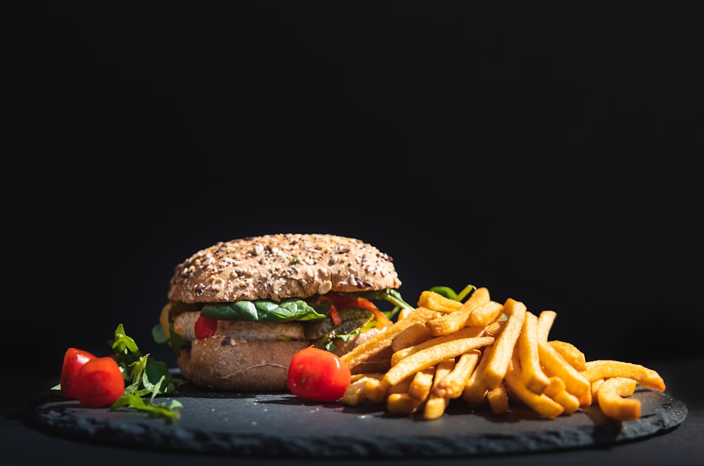 a burger and fries on a plate