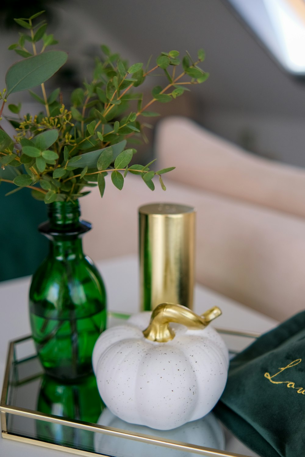 a candle and a vase on a table