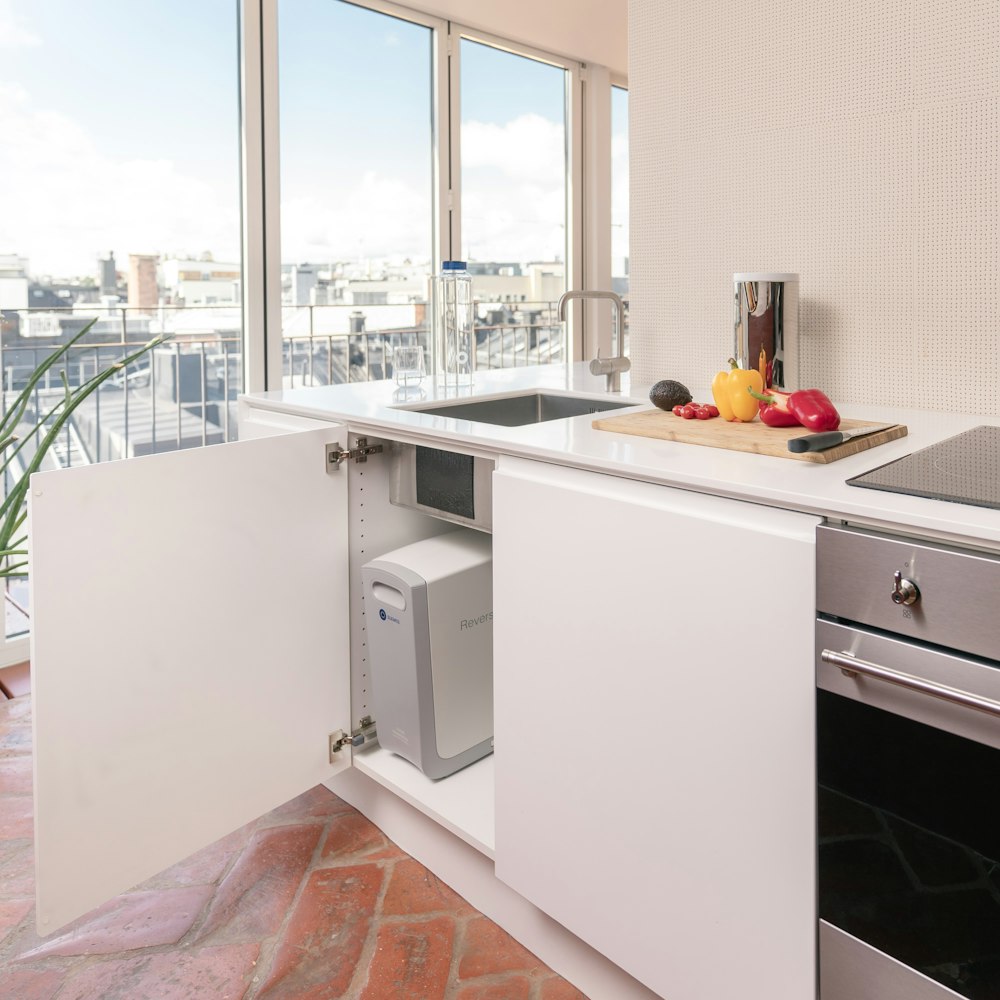 a kitchen with white cabinets