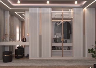 a room with a tv and shelves