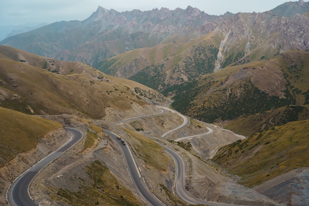 a winding road through a valley