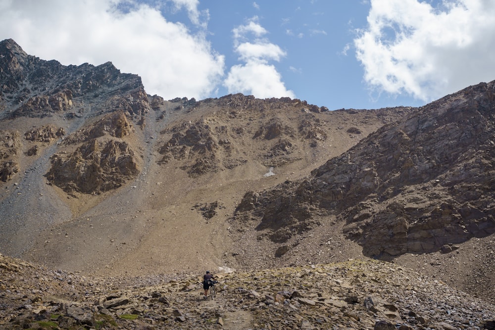 a person walking on a rocky terrain