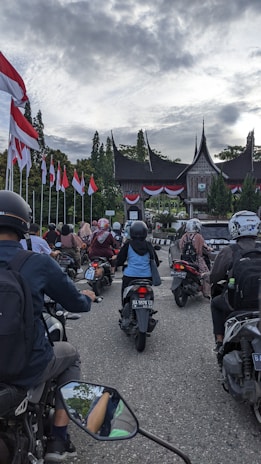 A group of friends riding rental motorbikes together through the lively streets of Jogjakarta.