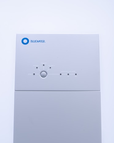 a white rectangular object with a blue circle on it
