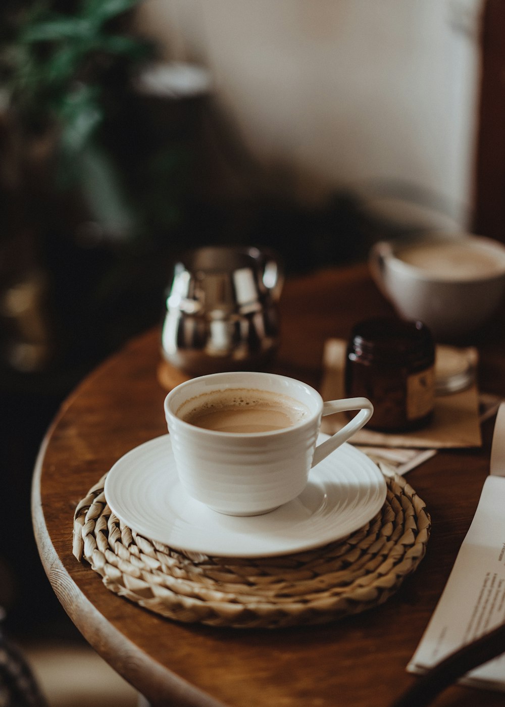 a cup of coffee on a plate