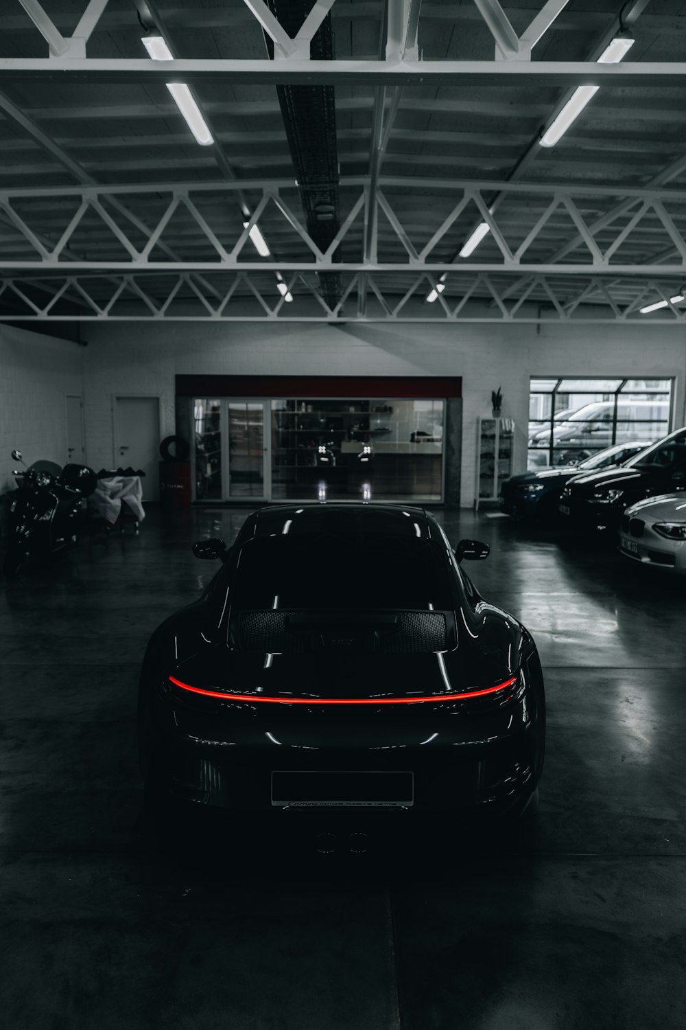 a black car parked in a garage