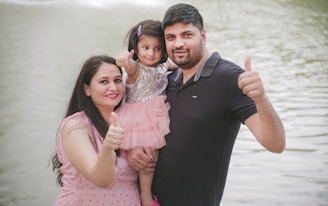 a person and two girls posing for a picture