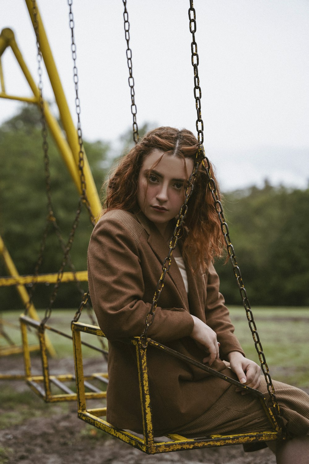 a person sitting on a swing