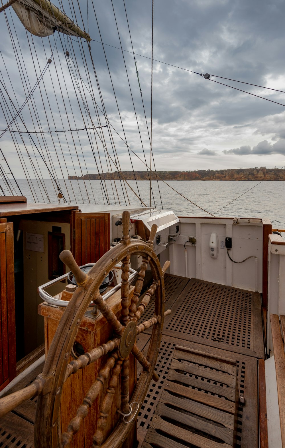 a boat with a wooden wheel