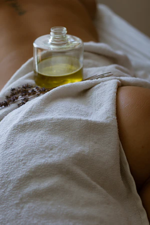 a bottle of alcohol on a blanket