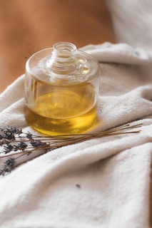 a glass jar with a yellow liquid