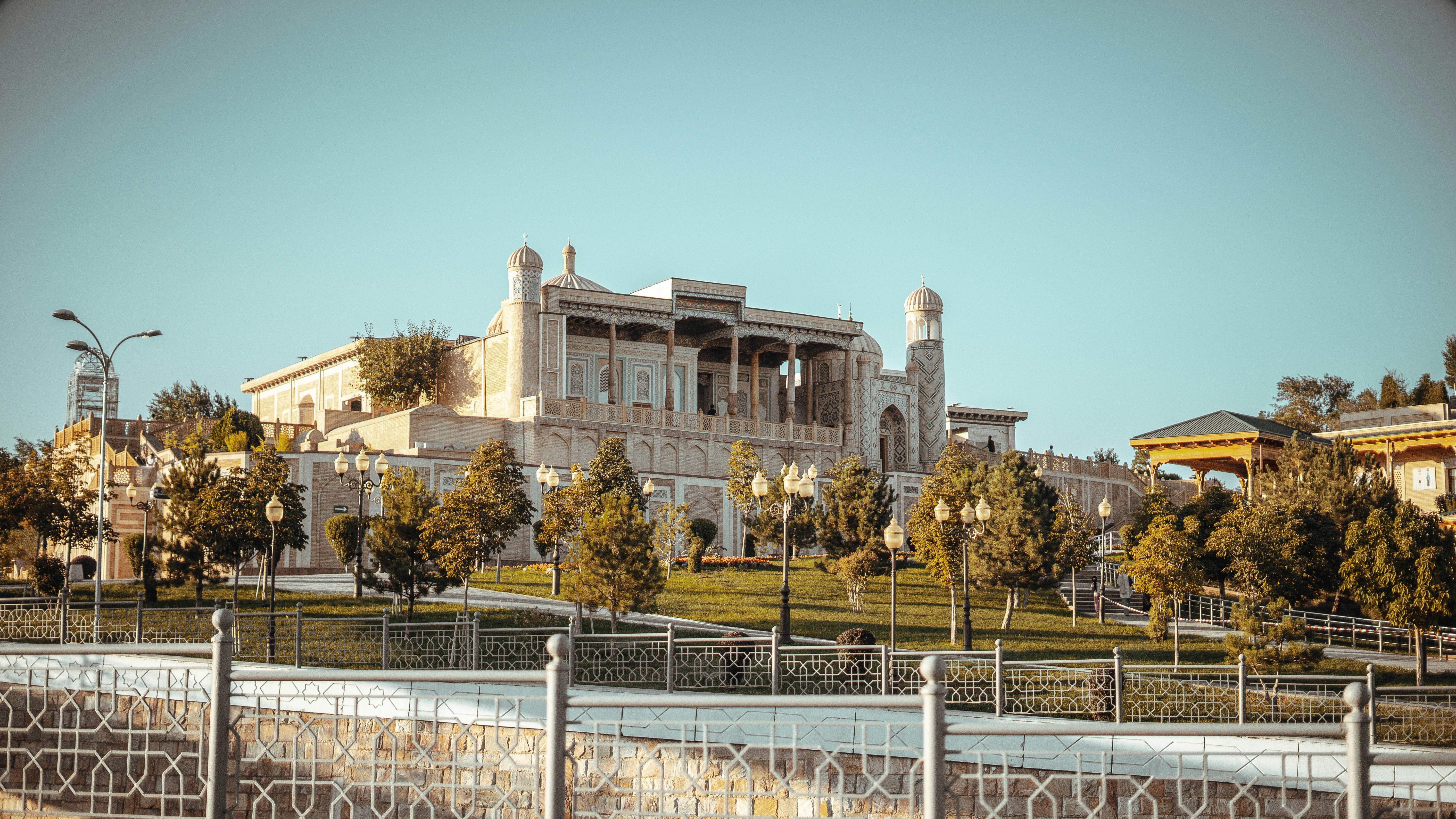 a large building with a fence in front of it