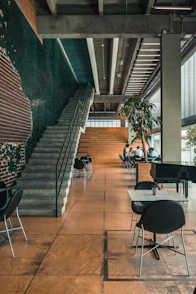 a group of people sitting at tables in a building