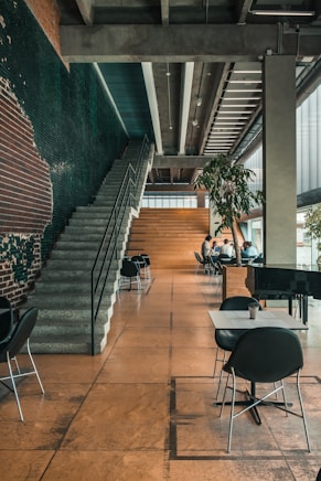 a group of business people sitting at tables in a building