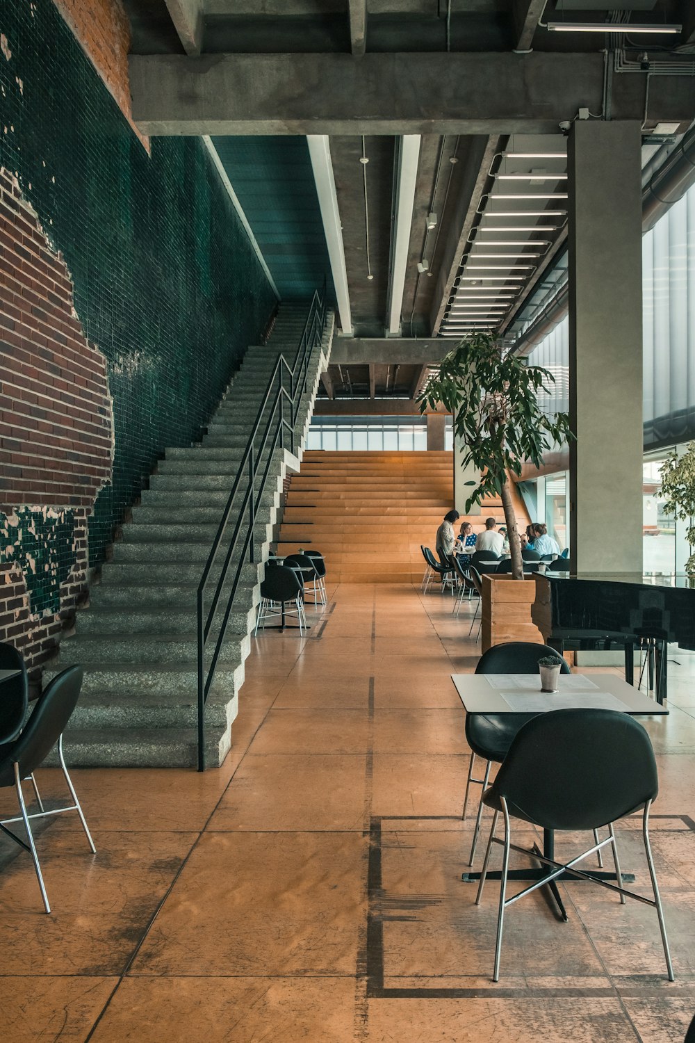 a group of people sitting at tables in a building