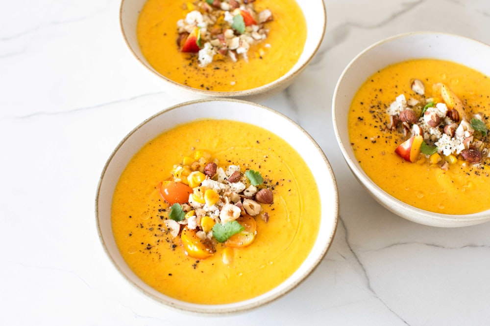 a group of bowls with food in it