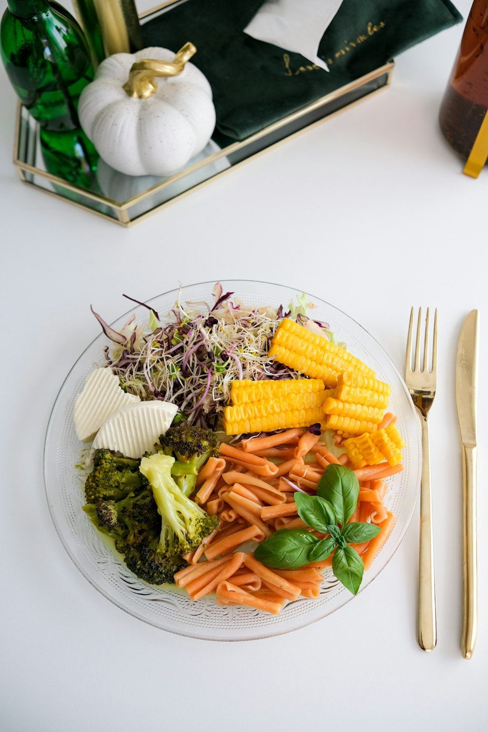 a plate of vegetables and a fork