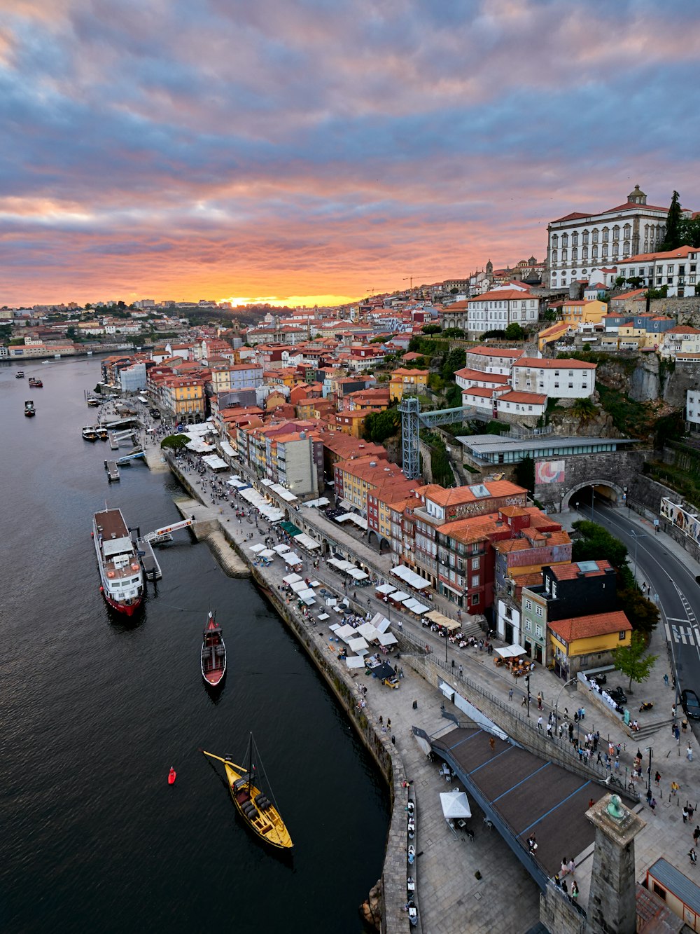 a river with boats and buildings along it