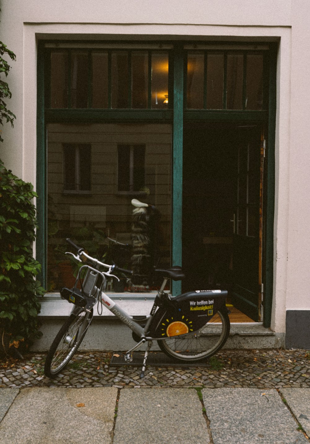 a bicycle parked in front of a building