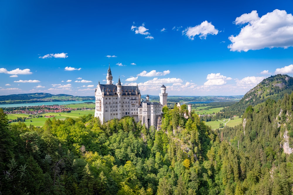 a castle with Neuschwanstein Castle in the background