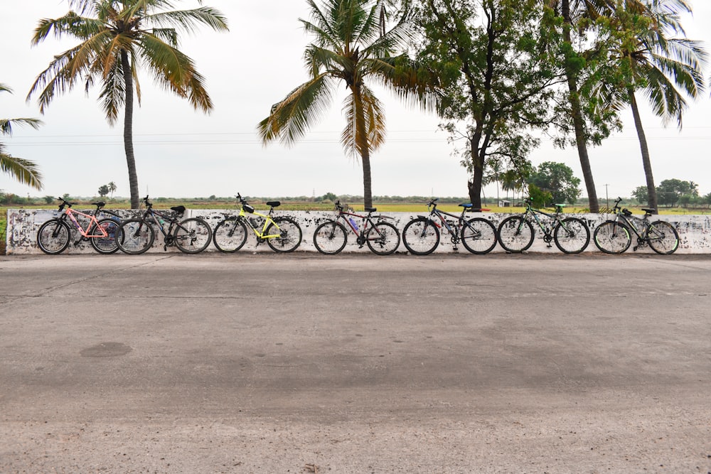 a group of bicycles parked on a beach