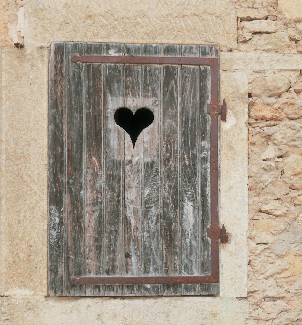 a wooden door with a hole in it