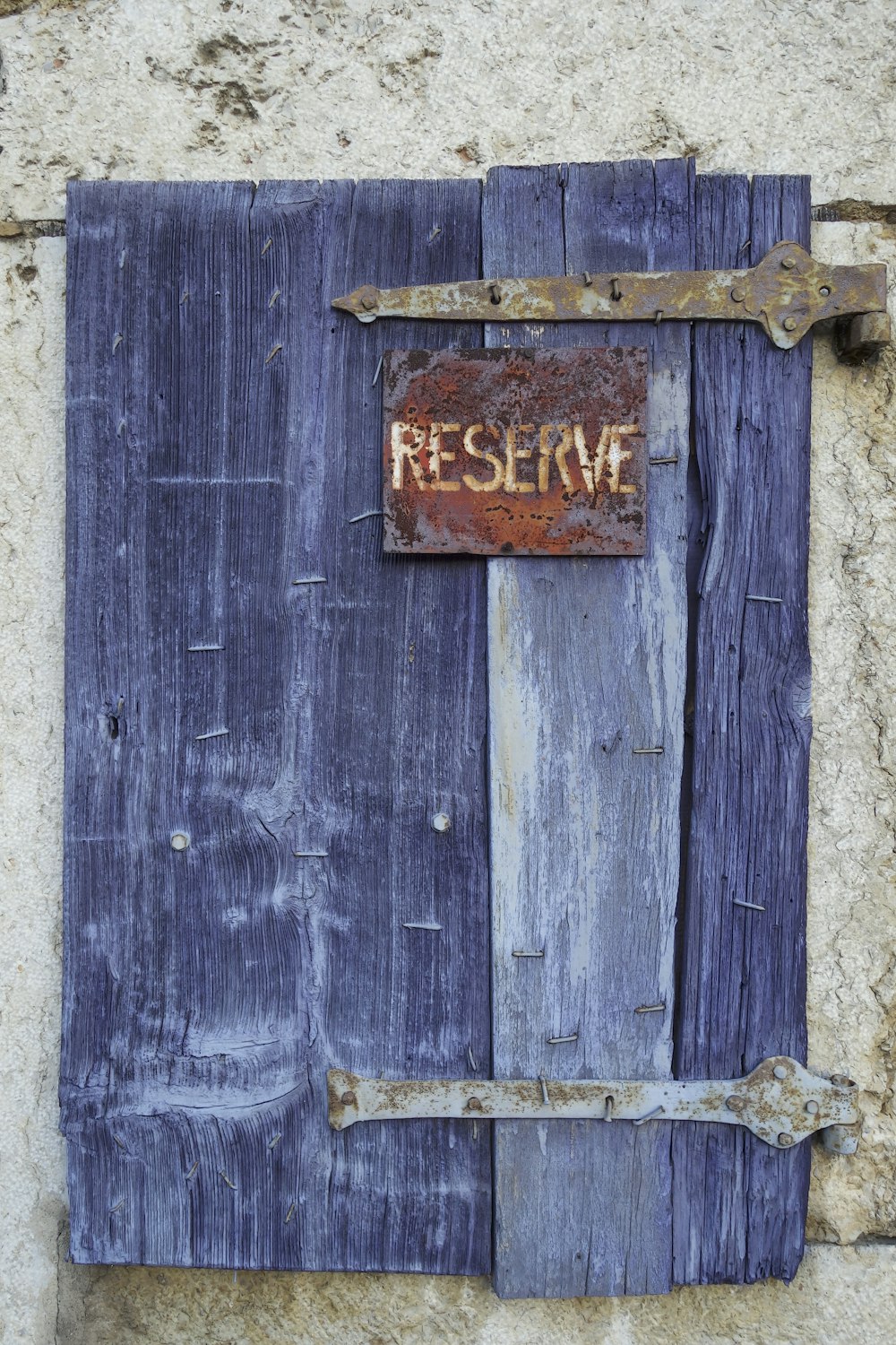 a wooden door with a sign on it