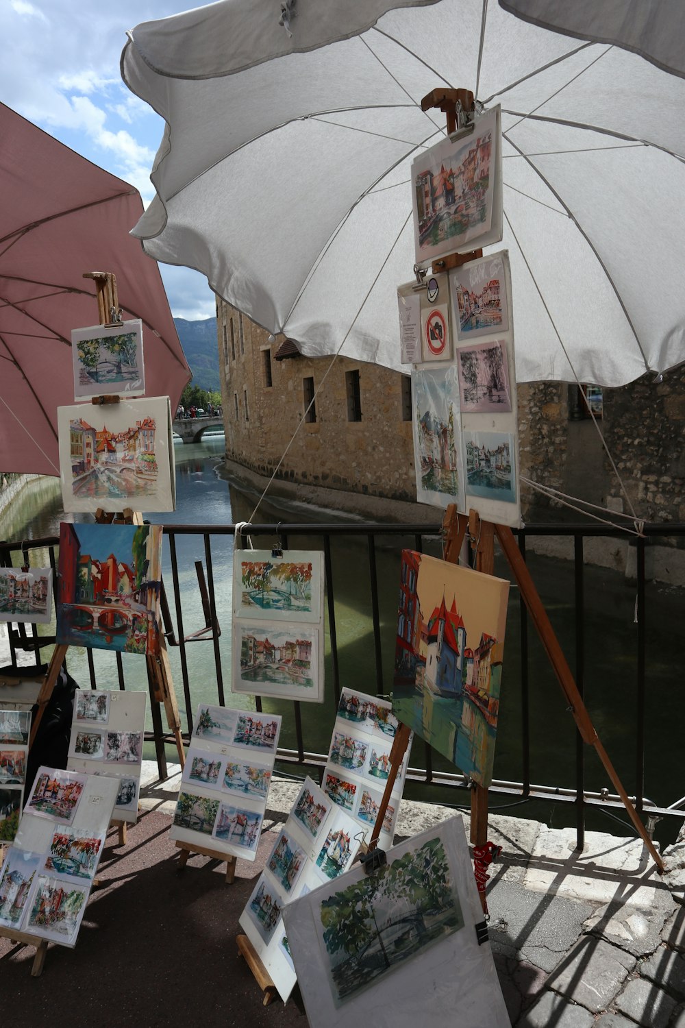 a white umbrella over a table full of books