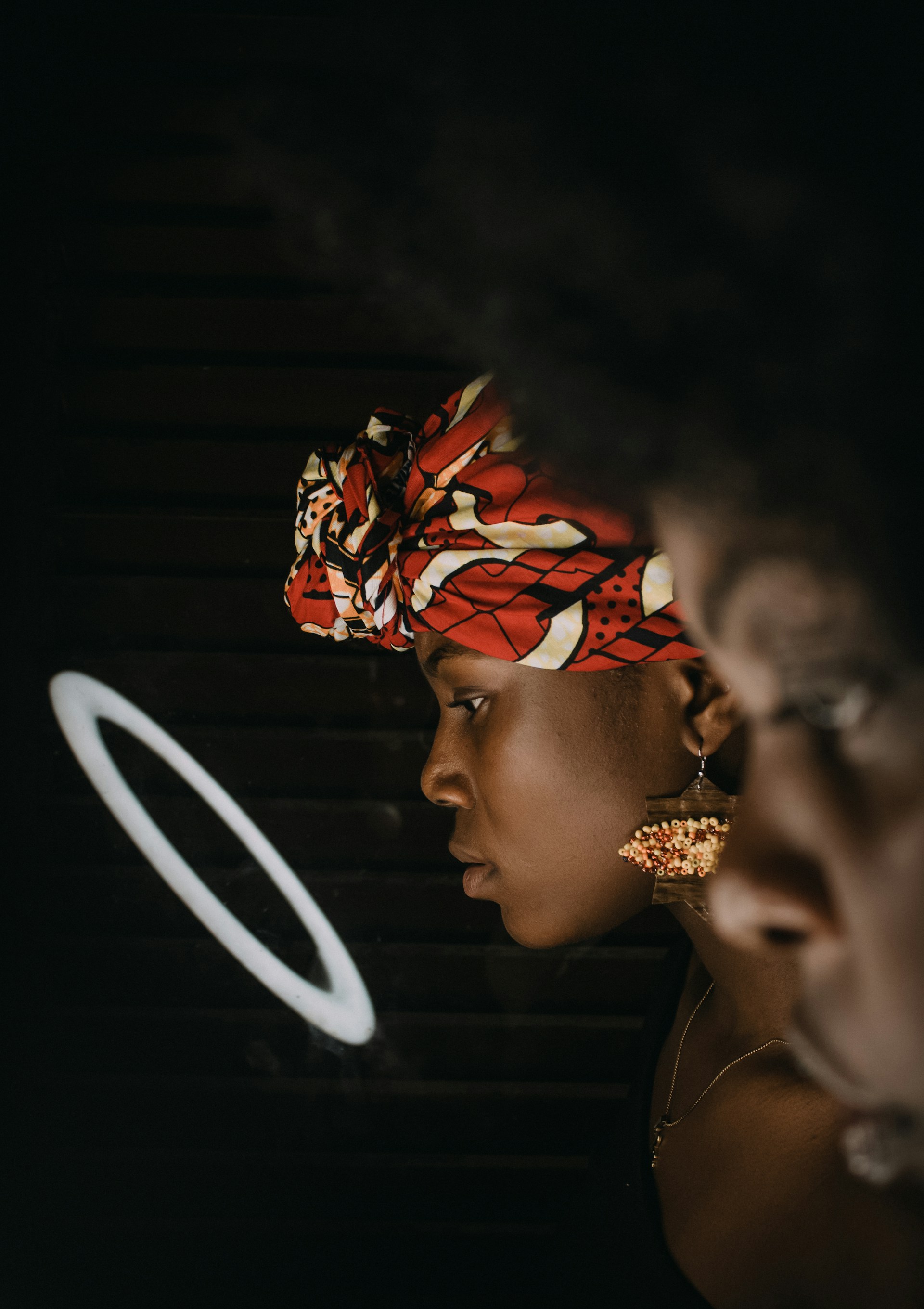 a person with a red and white headdress