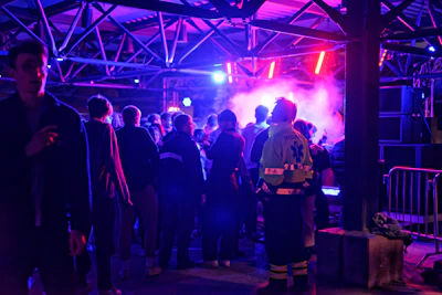 Professional security team managing crowd control at a lively corporate event.