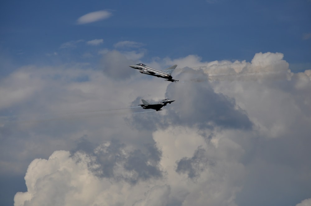 two planes flying in the sky