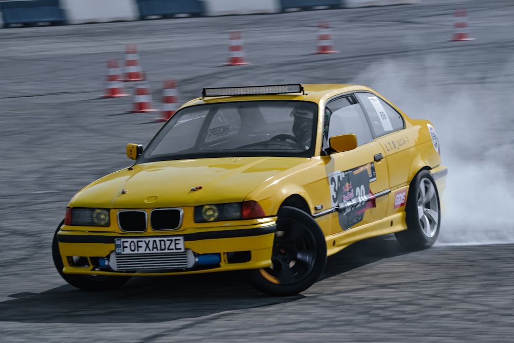 a yellow race car on a track