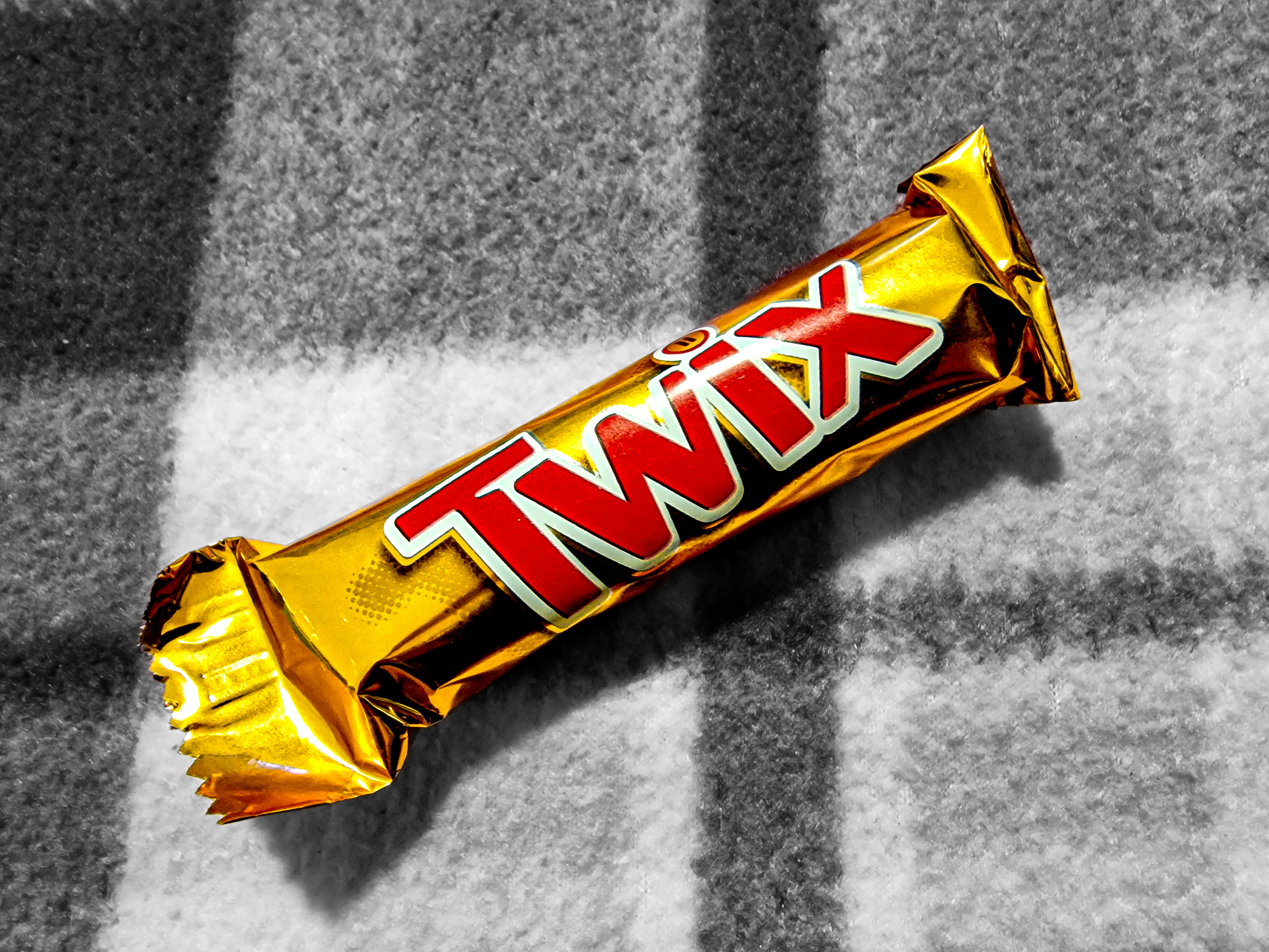 Twix caramel cookie chocolate bar in gold and red wrapper