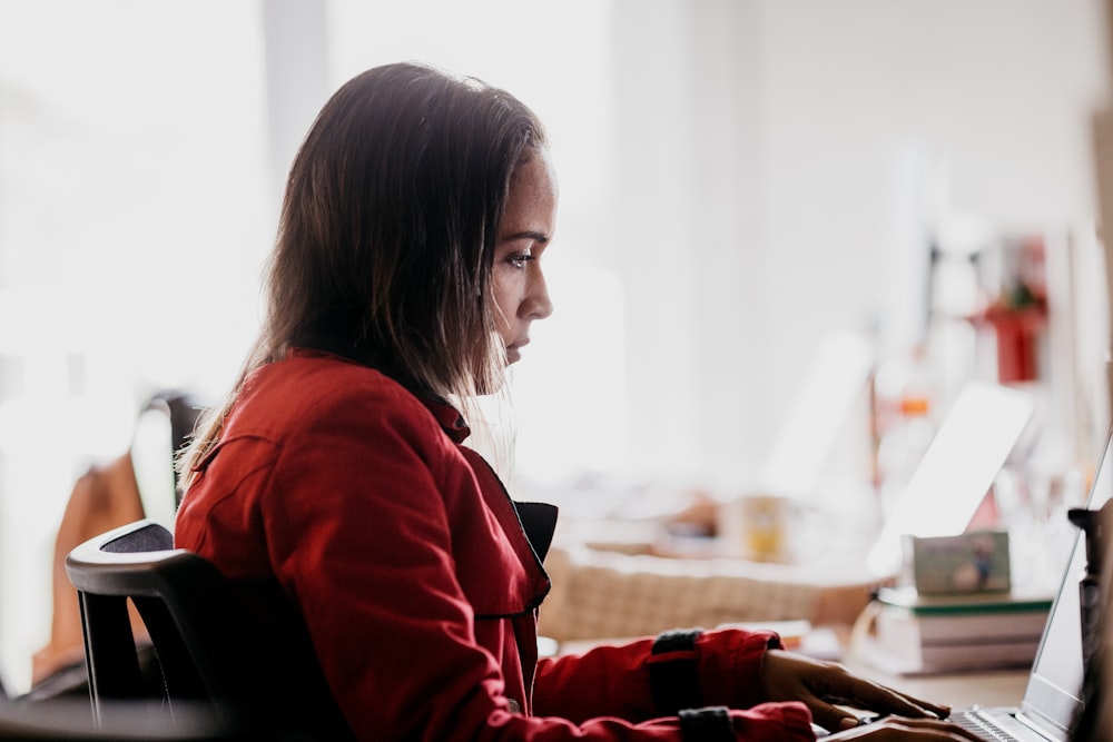 a woman sitting at a desk