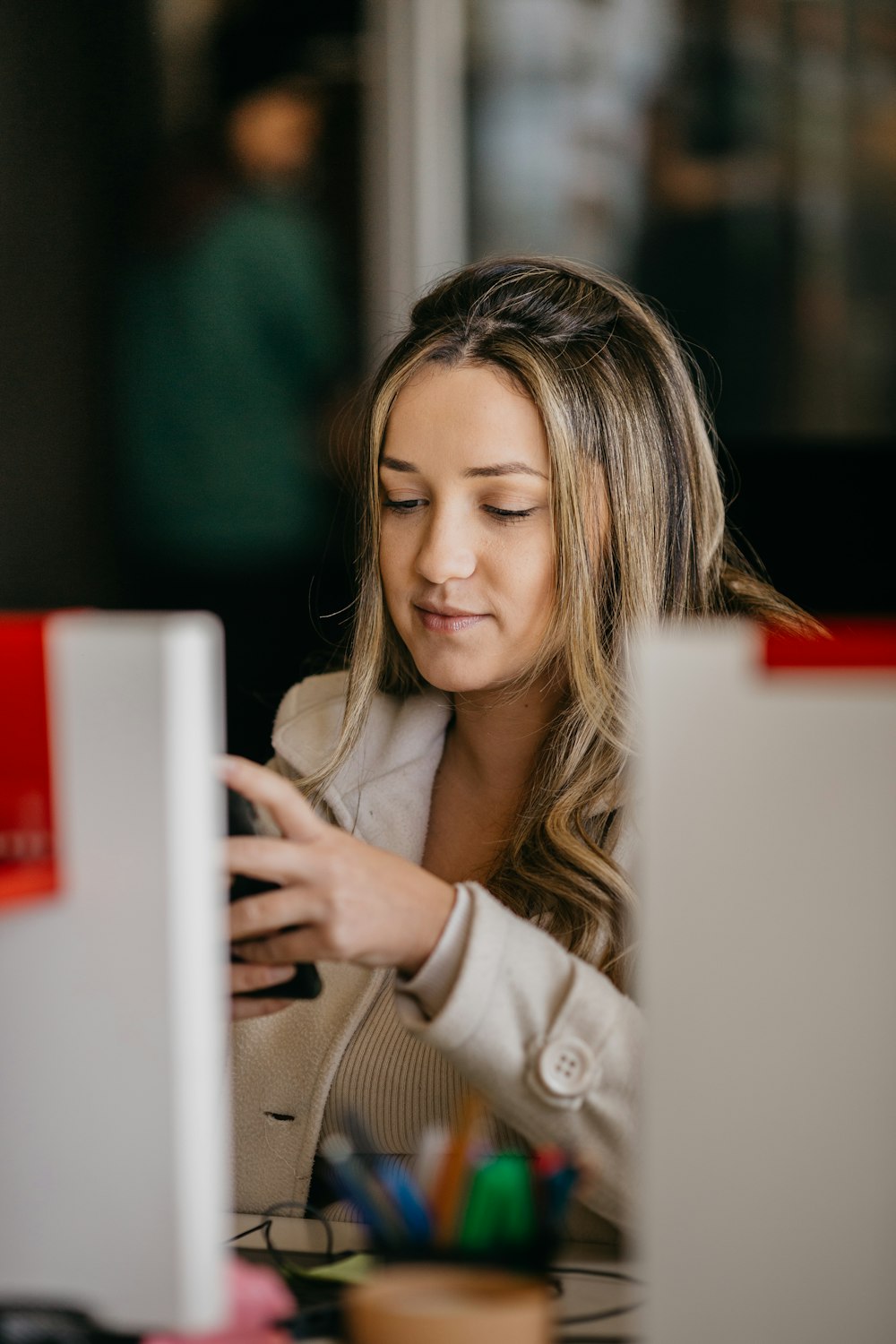 a woman looking at a computer