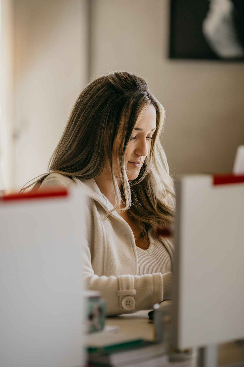 a woman looking at a computer